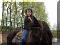 Me riding Lacey, the helmet is good for safety.