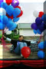 My sister Loni Nicole with some balloons at the parade.